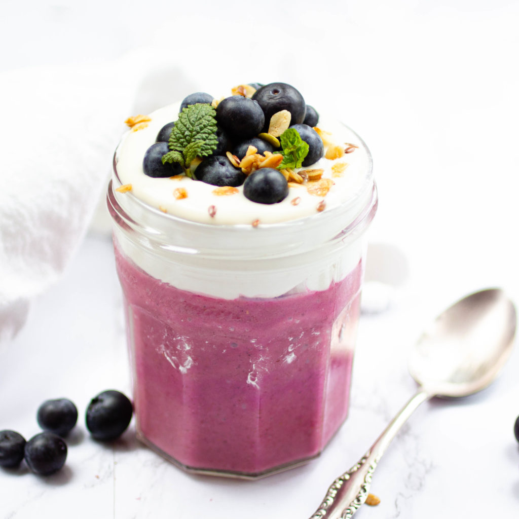 A Chia Pudding topped with yogurt and blueberries 